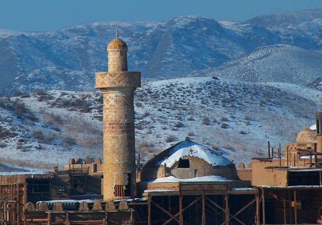 Minarets of wooden town on Ili river.