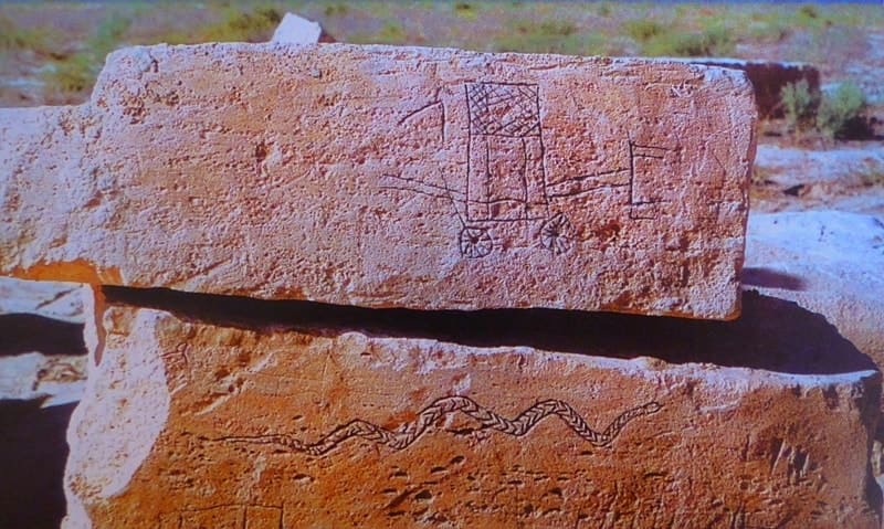 Stone blocks of the Sarmatian temple-sanctuary Baite III with images of signs, fish, snake and cart.