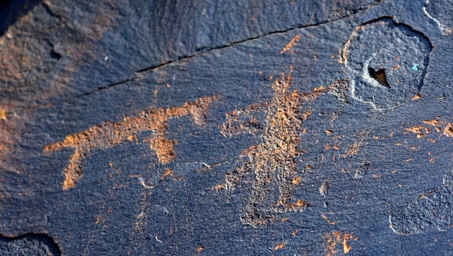 The Animal and the person. Petroglyphs the Bayan-Zhurek.