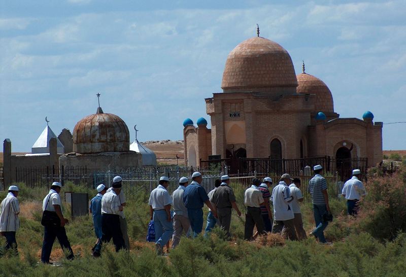 Pilgrims in the neighborhood of the mausoleum Arstan bab.