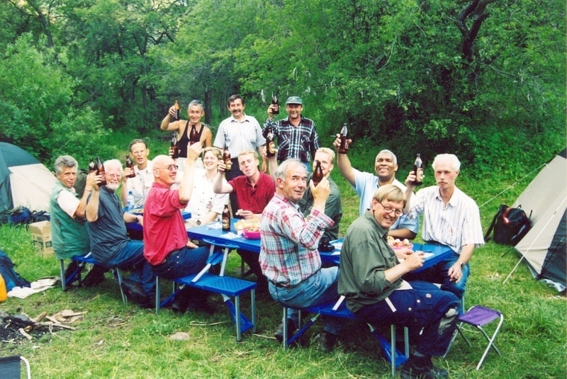 The person who sits in the foreground in a half-turn in a plaid shirt - Mr. Lemmers.