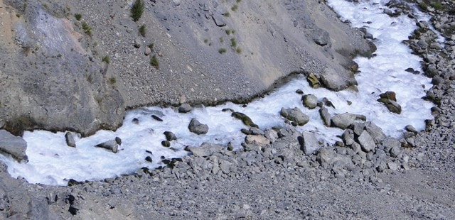 After a dam the river Issyk flows in deep, washed away селем a canyon.