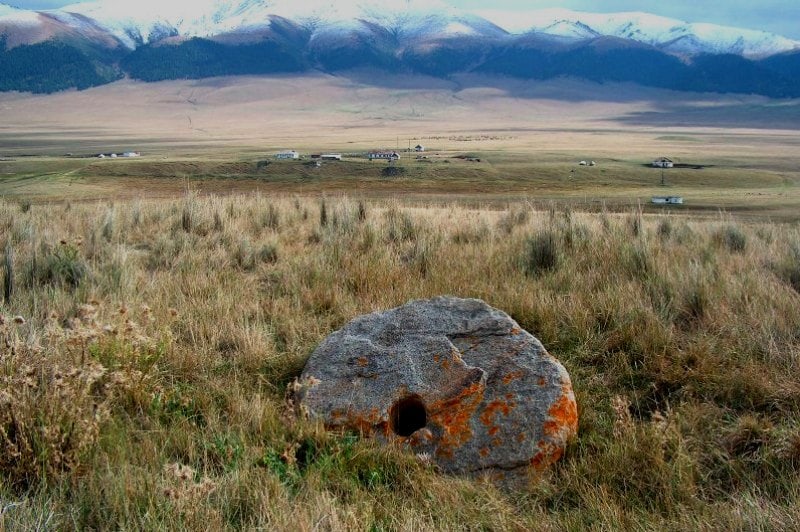 Ancient millstones on plateau Assy.