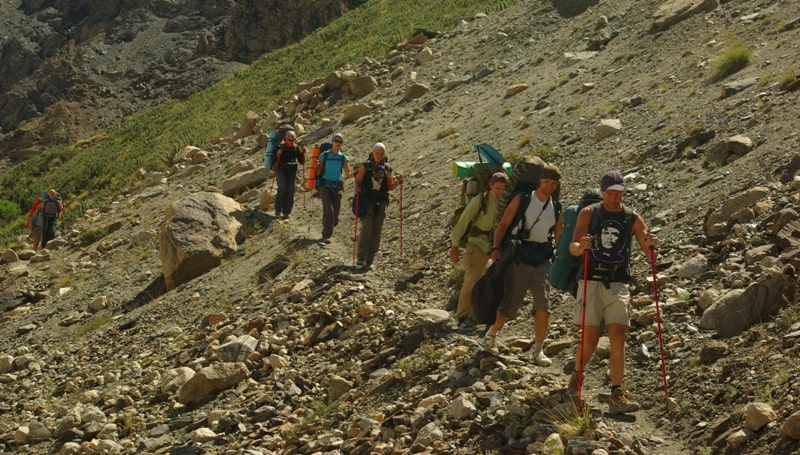 Group of tourists between camps At-Dzhailoo and Peak Nansen.