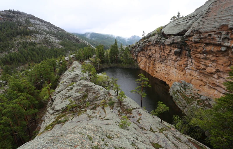 A lake with the poetic name of Moldir is located in granite cliffs.