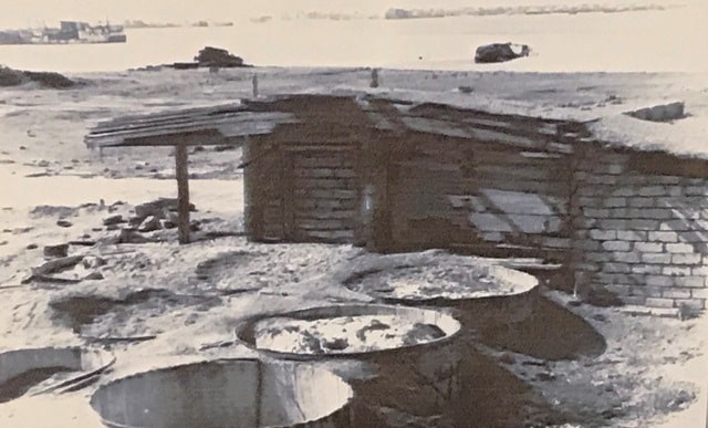 Remains of the facade of the glacier Z.K. Oak and wooden pickling tanks. The village of Nikolaev. 1982.