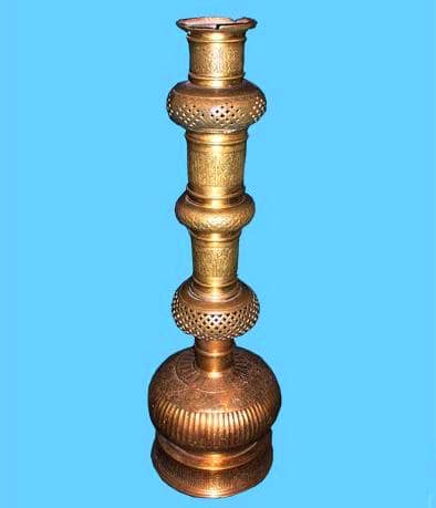 Cylindrical bronze candlestick 14th century. Made by order of Amir Timur for the mausoleum of Khoja Ahmed Yasawi by the master from Isfahan Iz et-Din bin Taj ed-Din June 17, 1397. Height - 68 cm, width - 21 cm.