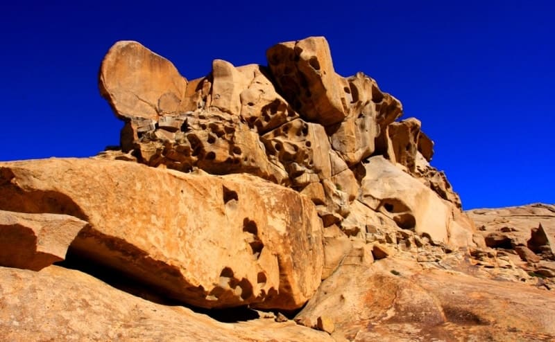Hidden underground for three million centuries, it now rises boldly in vast expanses of Sary Arka, visible from tens of kilometers away. Unborn volcanoes that never break through to  surface are called plutons, in honor of Greek god of the underworld.