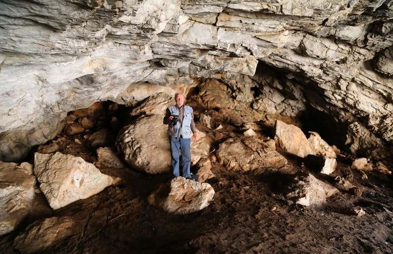 The Aktogay Cave is located at an altitude of 730 meters above sea level, on the right side of the Aktogay Gorge, 248 meters from the Aktogay River, 1.6 kilometers west of the Aktogay village, in the western part of the Ulken-Aktau Mountains.
