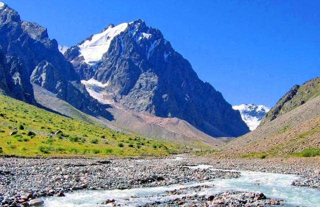Themountain top of Karaulshetau, 4269.2 m. a. s. l. View from the Sredny Talgar River.