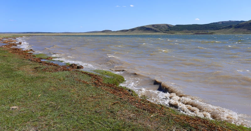 Standing on shore of Lake Bolshoe, it's hard not to feel a sense of antiquity - sky, mountains, and history of Kazakhstan itself are reflected in mirror-like water.