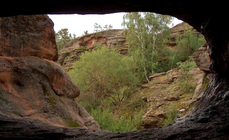 In 1947, employees of Karaganda Regional Museum discovered scrapers and bones of domestic animals in Three Caves.