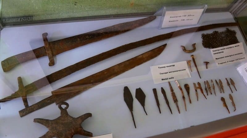 Display cases with artifacts in halls of the old museum.