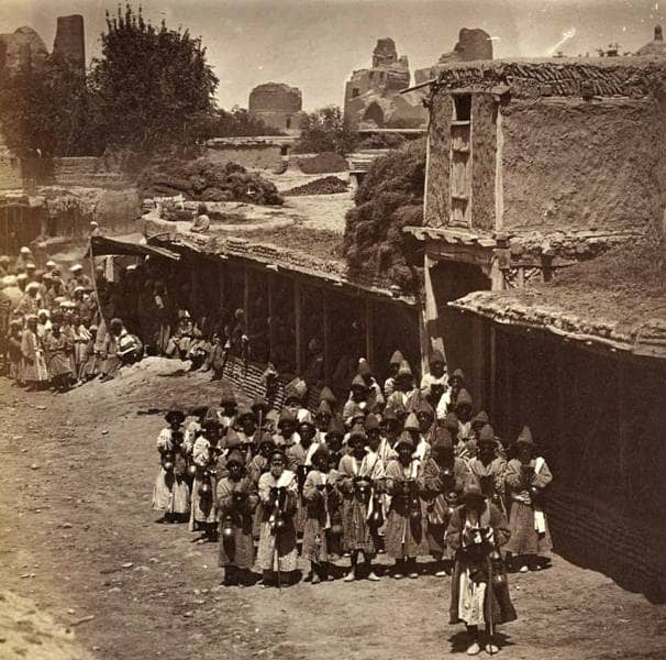 Dervishes Prayer. Samarkand. 1871-1872. The Samarkand community of dervishes-kalandars pray before collecting alms. The photo was taken between the Bibi-Khanym Mosque (in the background) and Registan Square. Photo from the Turkestan Album. Ethnographic Section.