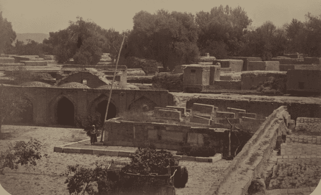 The photograph depicts the courtyard of the Sheibani Khan Madrasah and the ruins of the Kuchkunji Khan Mausoleum in Samarkand. The photograph was taken between 1871–1872. The photograph is part of the archaeological section of the famous "Turkestan Album." This monumental six-volume publication was prepared and published under the patronage of the first Governor-General of Turkestan, Konstantin Petrovich von Kaufman. Visible in the foreground is the Sheibanid dakhma - an elevated structure faced with gray marble where the tombstones of members of this dynasty were erected. Stone sarcophagi (sagana) are visible in the center of the image, arranged somewhat haphazardly. At the beginning of the XXth century, the madrasah was finally destroyed, and the dakhma was moved to another location.