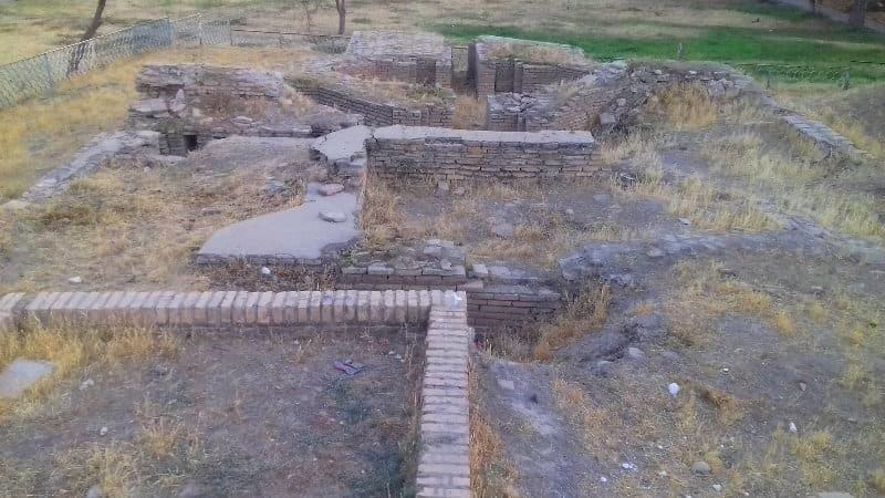 Part of the surviving remains of the Bukhara emir's palace, presumably near Kuksaray (new bricks are laid on top of the foundation to illustrate the building's outline), in the eastern part of Kuksaray Square in Samarkand. August 2018.