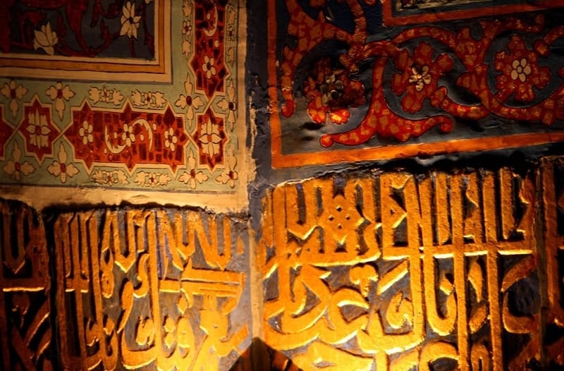 Interior painting in the Tillya-Kari Madrasah. The walls are also decorated with blue and gold tiles and patterns.