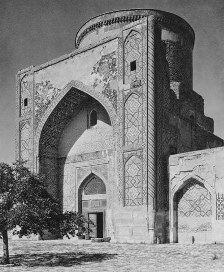 The Tillya-Kari Madrasah (also known as the Tillya-Kari Mosque-Madrasah), located on the famous Registan Square in Samarkand. Photograph by Petr Klepikov. The photograph was taken in 1947. It depicts the western iwan (interior façade) of the Tillya-Kari Madrasah in Samarkand. At that time, the monument had not yet been fully restored: the photograph shows the historical appearance of the portal and dome drum before the reconstruction of the outer blue dome, which was completed only in the 1970s.