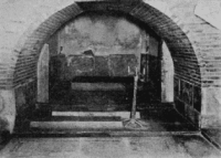 Tamerlane's (Amir Timur's) tomb inside the Gur-Emir Mausoleum in Samarkand. This is the final resting place of the great 14th-century Central Asian conqueror. The photograph dates back to the early 20th century or the time of the 1941 expedition. According to legend, the opening of this tomb by Soviet archaeologists on June 21, 1941, placed a curse on it, foreshadowing the outbreak of World War II. The mausoleum itself is a masterpiece of Central Asian architecture from the Timurid era.