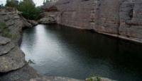 A lake nestled in granite in Karkaraly National Park.