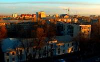 Rising above city.